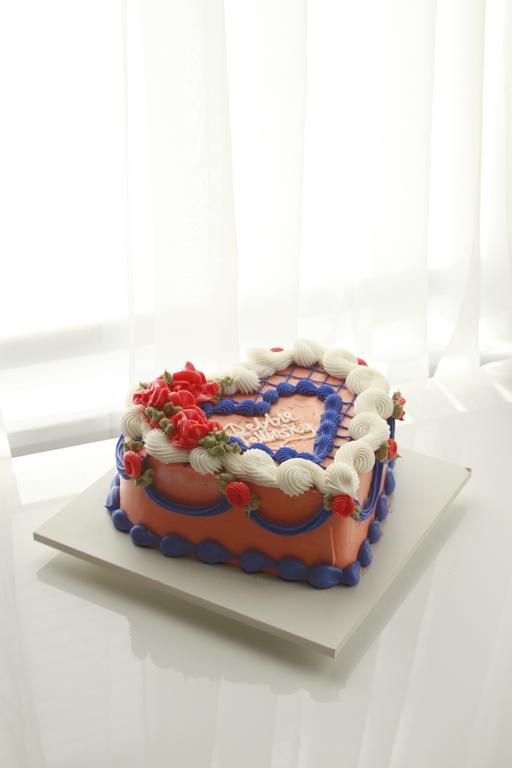 Angled view of Black Widow Cake on cake stand